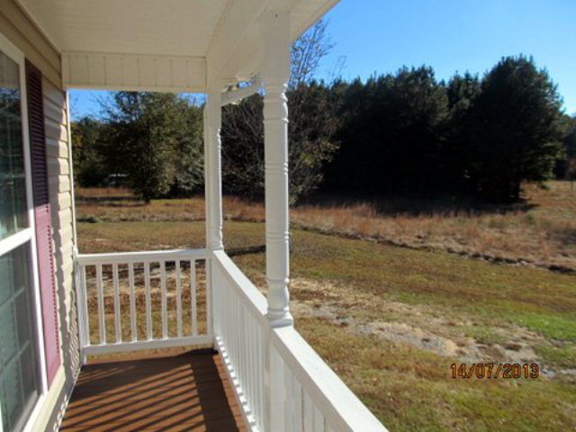 437 Comer Road Gray, GA 31032 - Photo 18 of 20 a view of balcony with wooden floor and fence