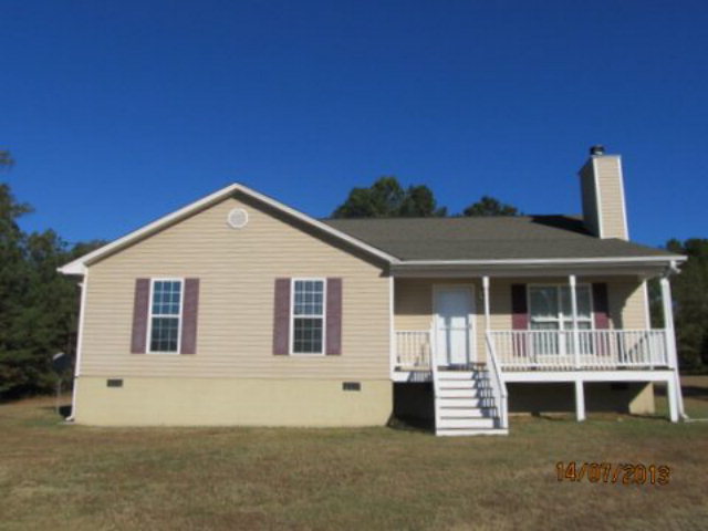 437 Comer Road Gray, GA 31032 - Photo 8 of 20 a view of house with yard and deck