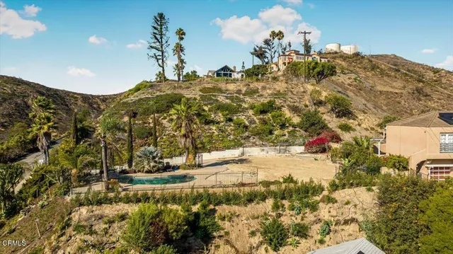 a view of a backyard of a house