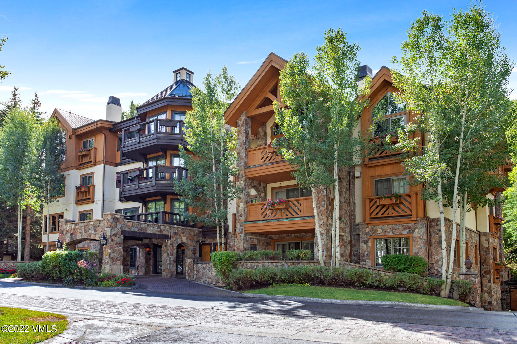 74 Willow Road, Unit 401D Vail, CO 81657 - Photo 26 of 29 a view of a street with a building in the background