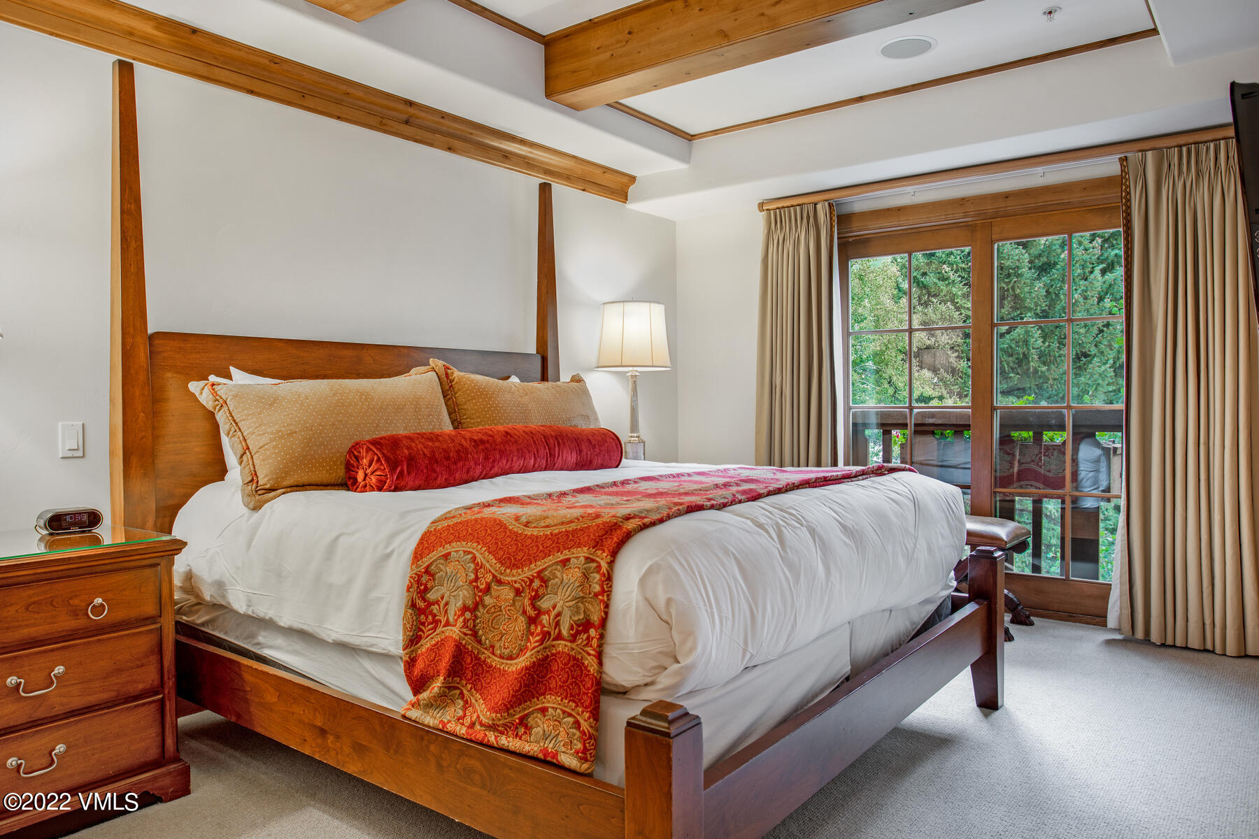 74 Willow Road, Unit 401D Vail, CO 81657 - Photo 9 of 29 a bed sitting in a bedroom next to a window