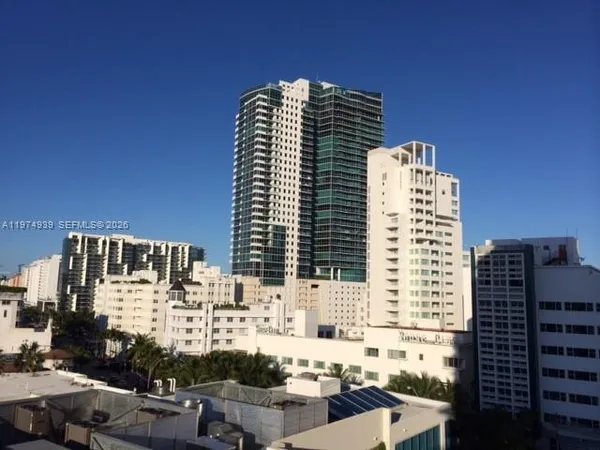 a view of a balcony with wooden chairs