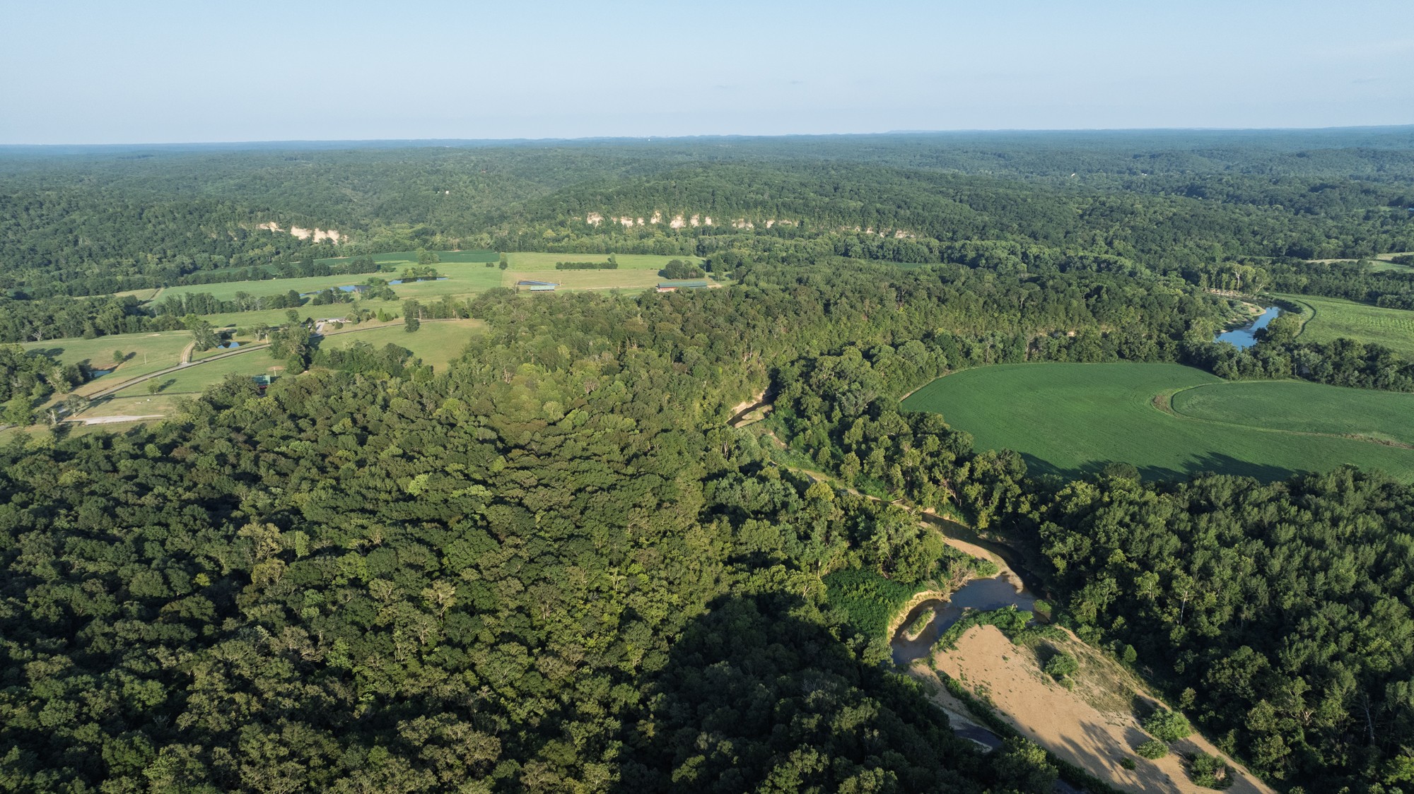 0 Collier Bend Road Charlotte, TN 37036 - Photo 58 of 77 an aerial view of residential houses with outdoor space and trees