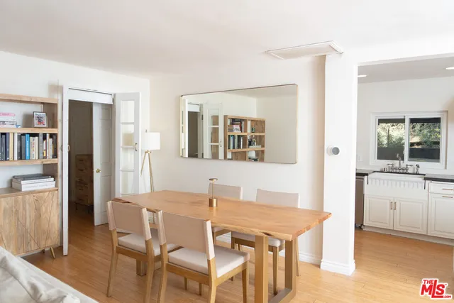 a dining room with a table and chairs