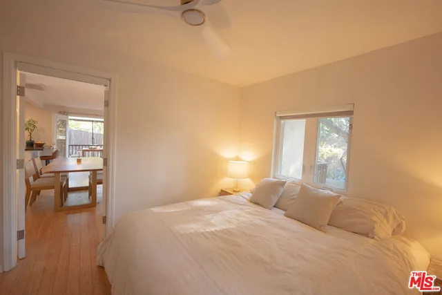 a bedroom with a bed and a table