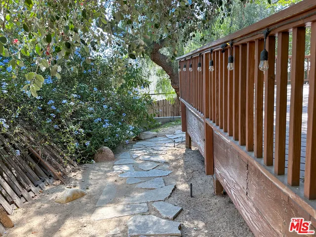 a view of a pathway of a wooden bridge