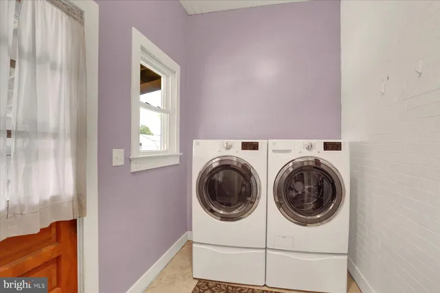 a utility room with dryer and washer