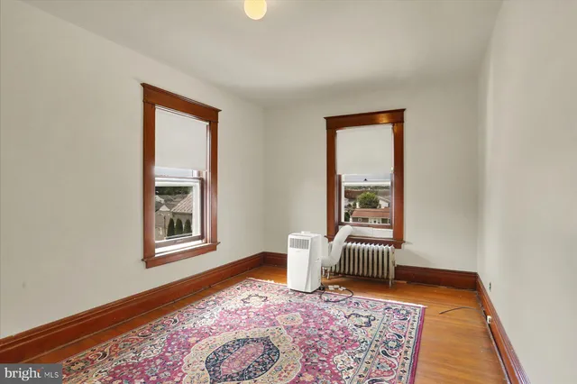 an entryway with a rug