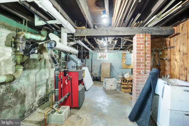 a view of a backyard with table and chairs under an umbrella