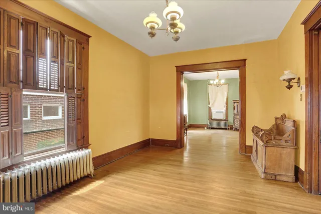 a view of livingroom with hardwood floor and dining room