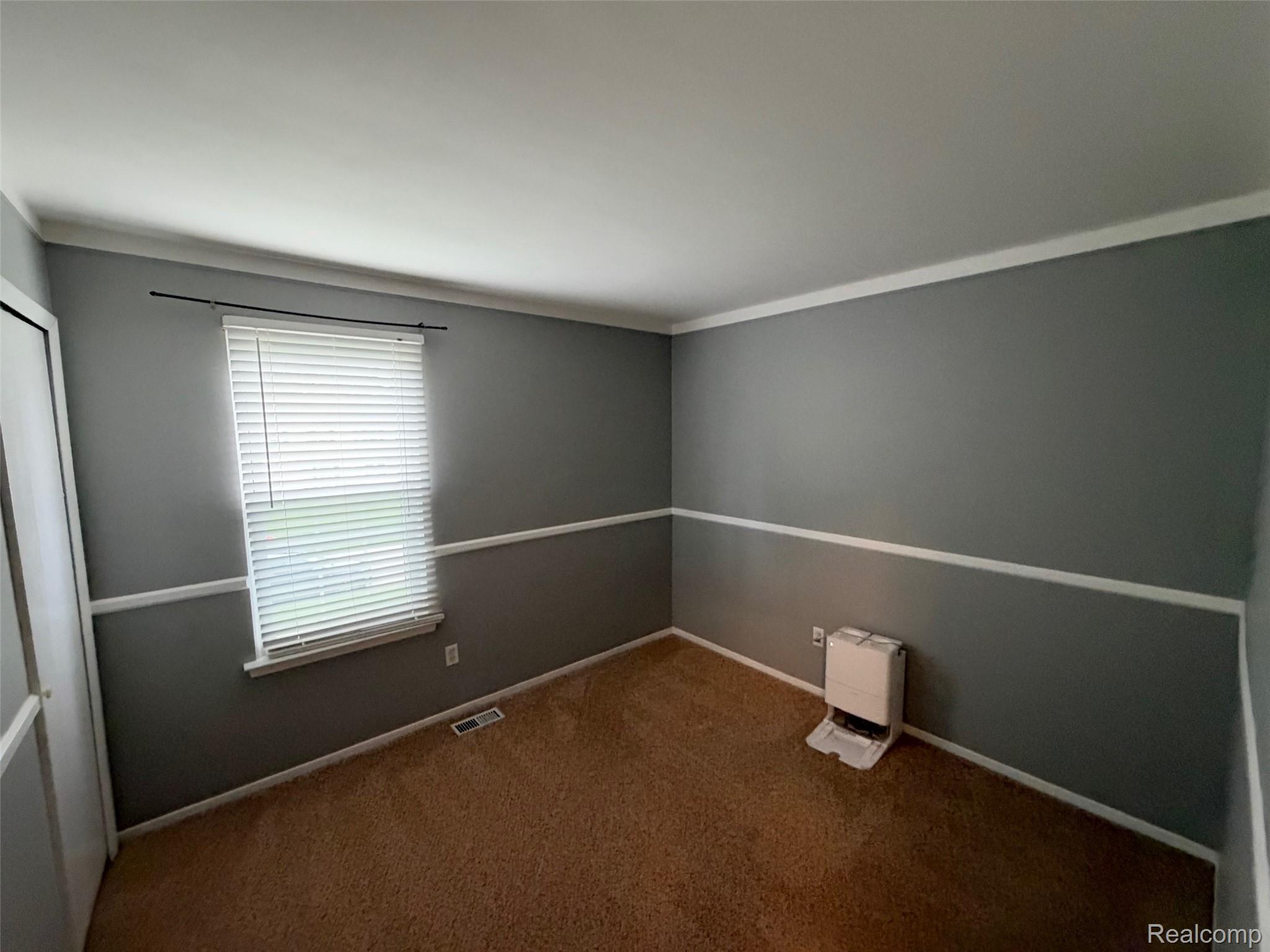 24525 Jamestowne Road Novi, MI 48375 - Photo 18 of 20 Wall-to-wall carpeting, crown molding, chair rail molding, window with blinds