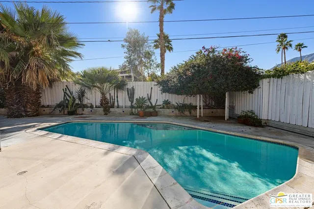 a view of a swimming pool with a patio