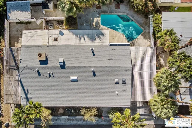 a buildings covered with tall trees