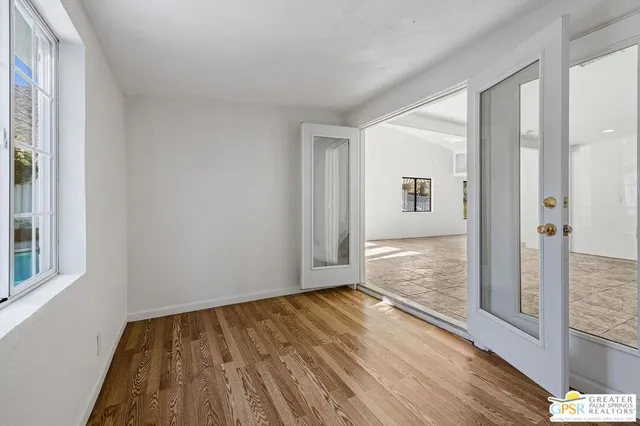 a view of wooden floor in an empty room