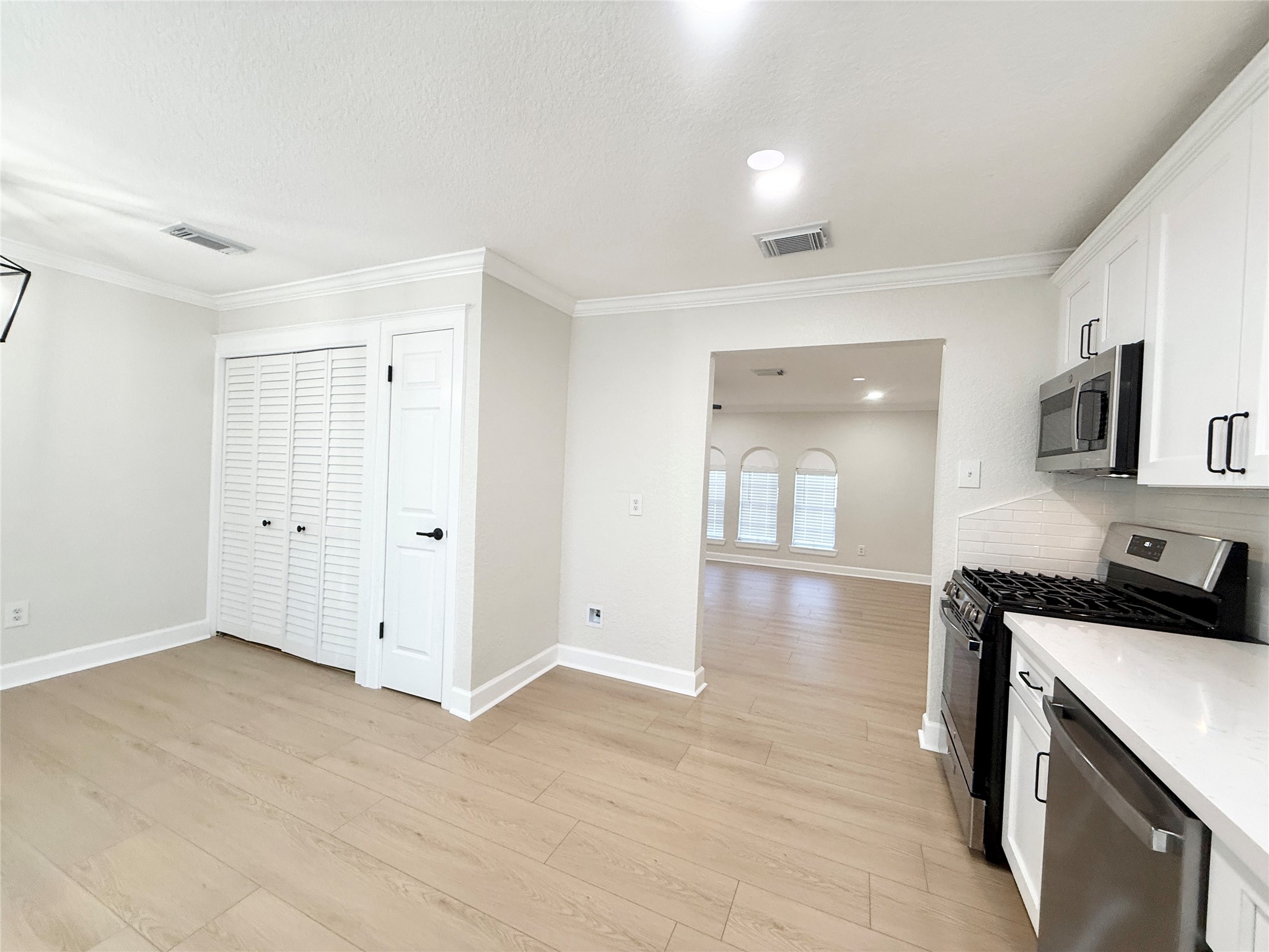 1429 Northview Drive Angleton, TX 77515 - Photo 11 of 29 a view of a kitchen with a sink and a stove top oven