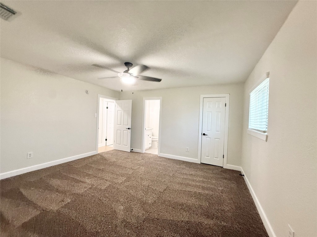 1429 Northview Drive Angleton, TX 77515 - Photo 14 of 29 a view of an empty room with a ceiling fan