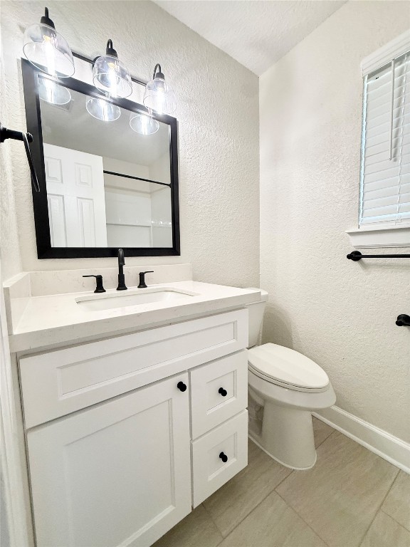 1429 Northview Drive Angleton, TX 77515 - Photo 18 of 29 a bathroom with a toilet sink and mirror