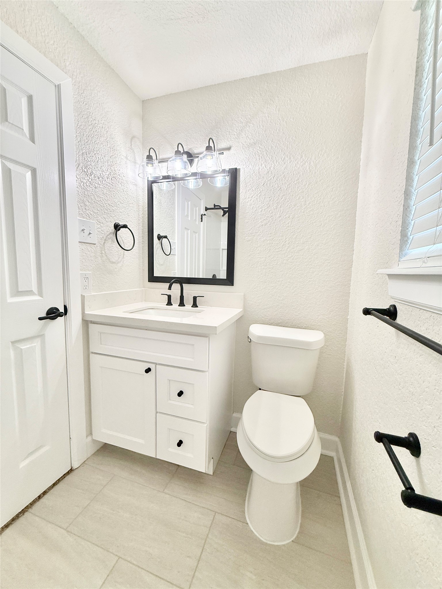 1429 Northview Drive Angleton, TX 77515 - Photo 19 of 29 a bathroom with a toilet sink and mirror