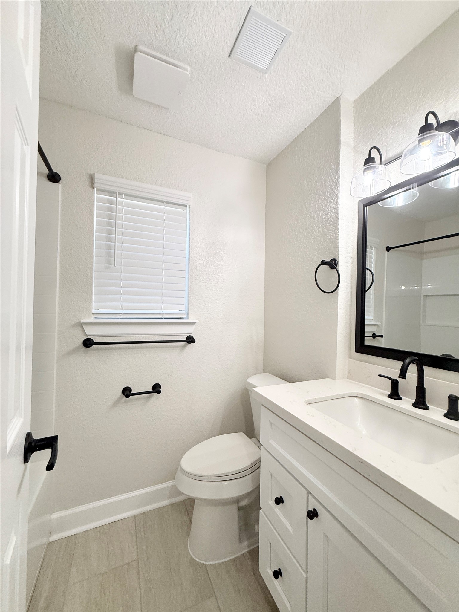 1429 Northview Drive Angleton, TX 77515 - Photo 22 of 29 a bathroom with a sink a toilet and mirror