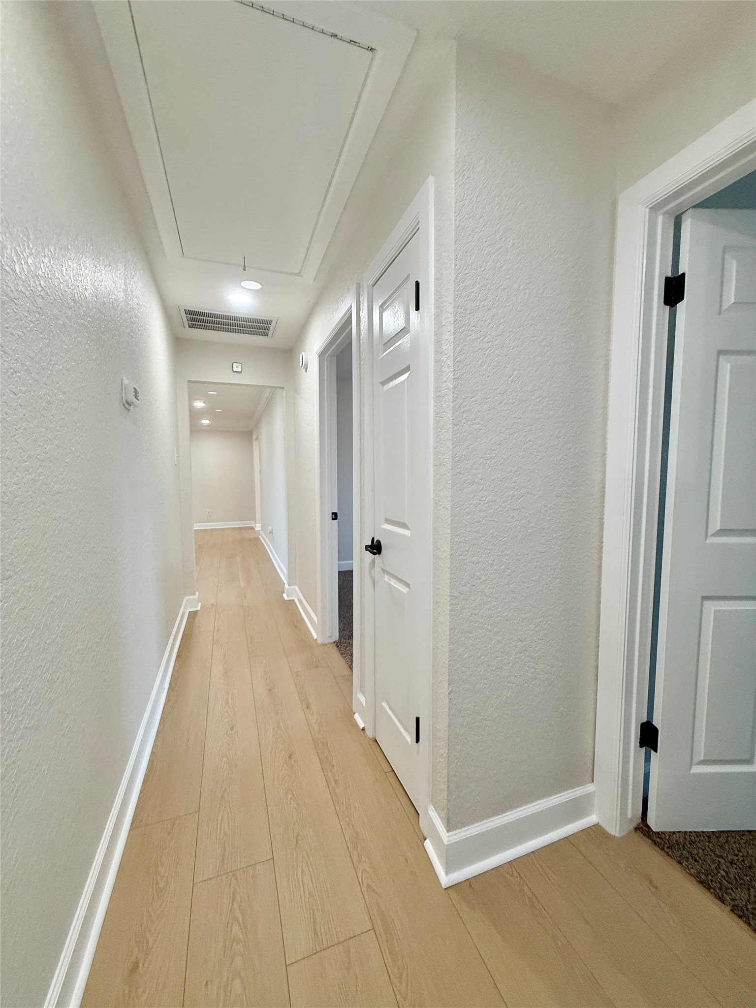 1429 Northview Drive Angleton, TX 77515 - Photo 25 of 29 a view of a hallway with wooden floor