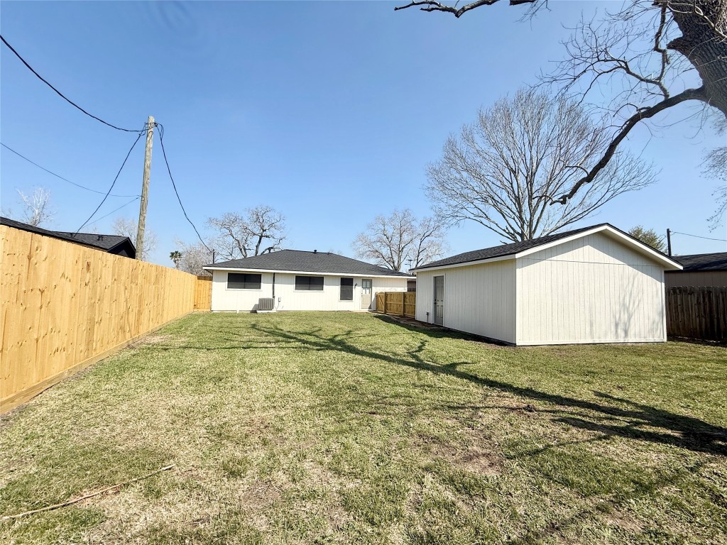 1429 Northview Drive Angleton, TX 77515 - Photo 29 of 29 a house with trees in front of it