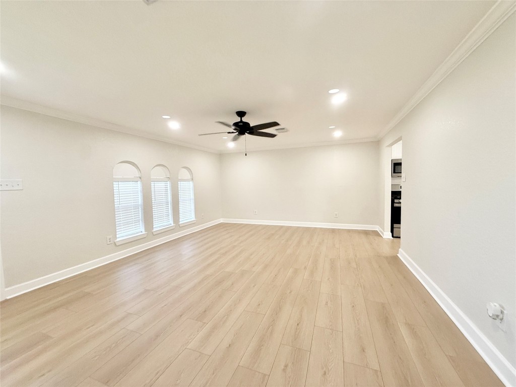 1429 Northview Drive Angleton, TX 77515 - Photo 3 of 29 wooden floor in an empty room with a window