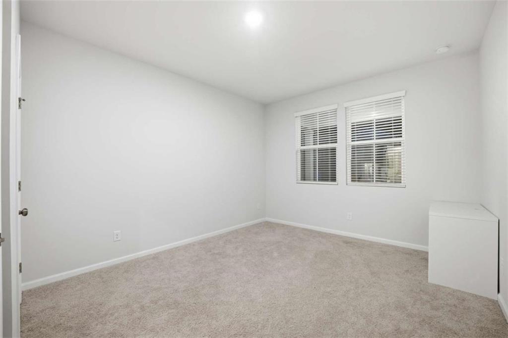 7129 Timberland Trail Lithonia, GA 30058 - Photo 17 of 43 a view of empty room with windows