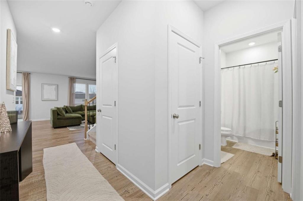 7129 Timberland Trail Lithonia, GA 30058 - Photo 21 of 43 a hallway with a furniture and a couch