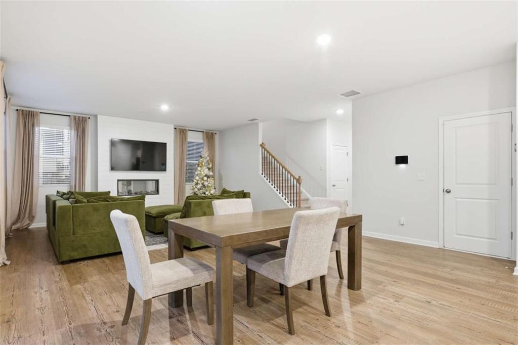 7129 Timberland Trail Lithonia, GA 30058 - Photo 27 of 43 a view of a livingroom with furniture and a flat screen tv