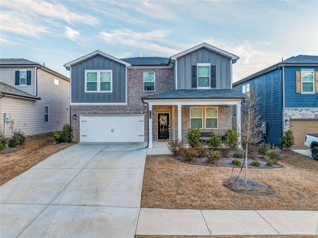 7129 Timberland Trail Lithonia, GA 30058 - Photo 3 of 43 a front view of a house with garden