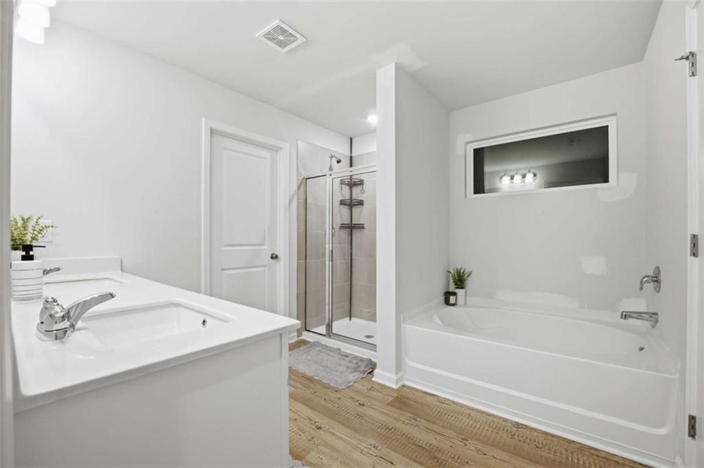 7129 Timberland Trail Lithonia, GA 30058 - Photo 39 of 43 a bathroom with a tub and a sink