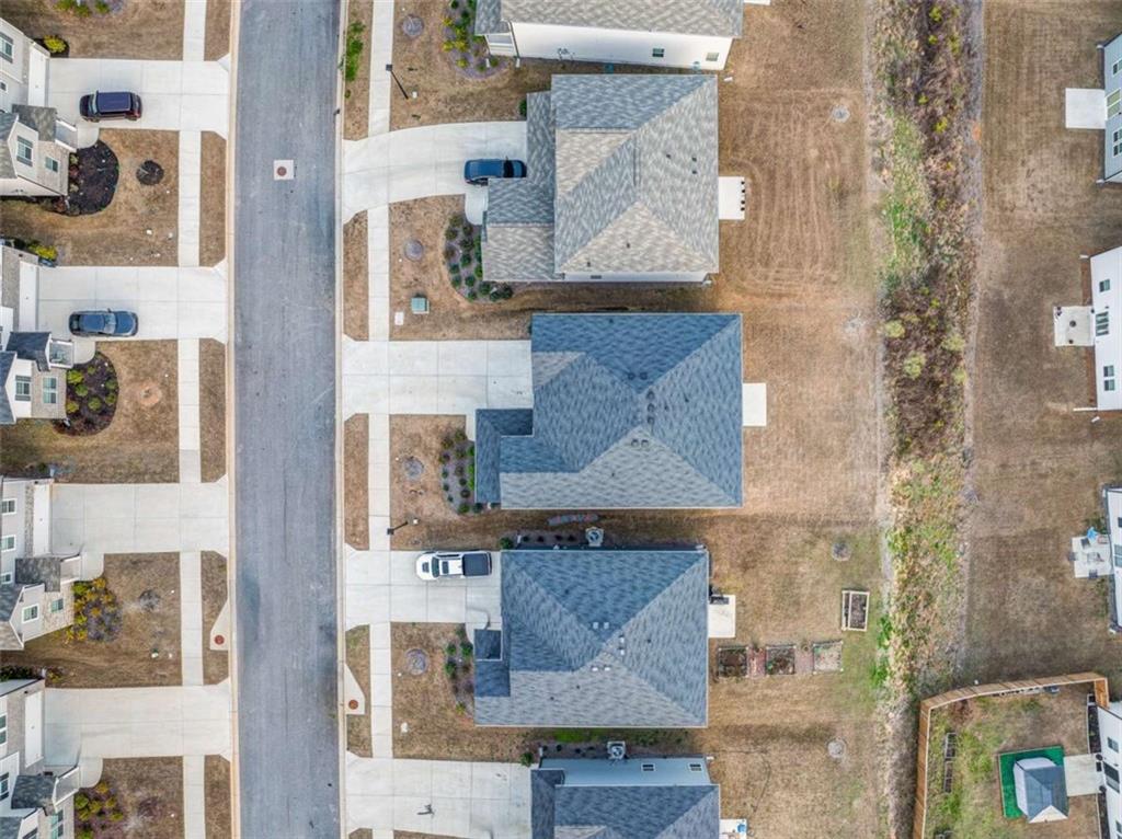 7129 Timberland Trail Lithonia, GA 30058 - Photo 7 of 43 an aerial view of residential houses with outdoor space