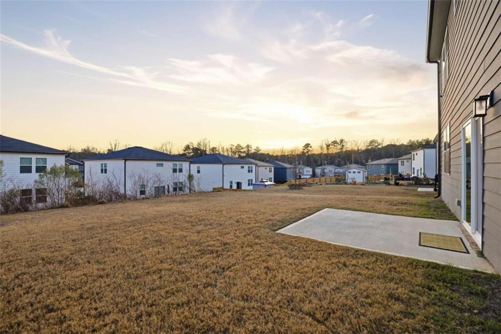 7129 Timberland Trail Lithonia, GA 30058 - Photo 10 of 43 a view of an house with backyard space