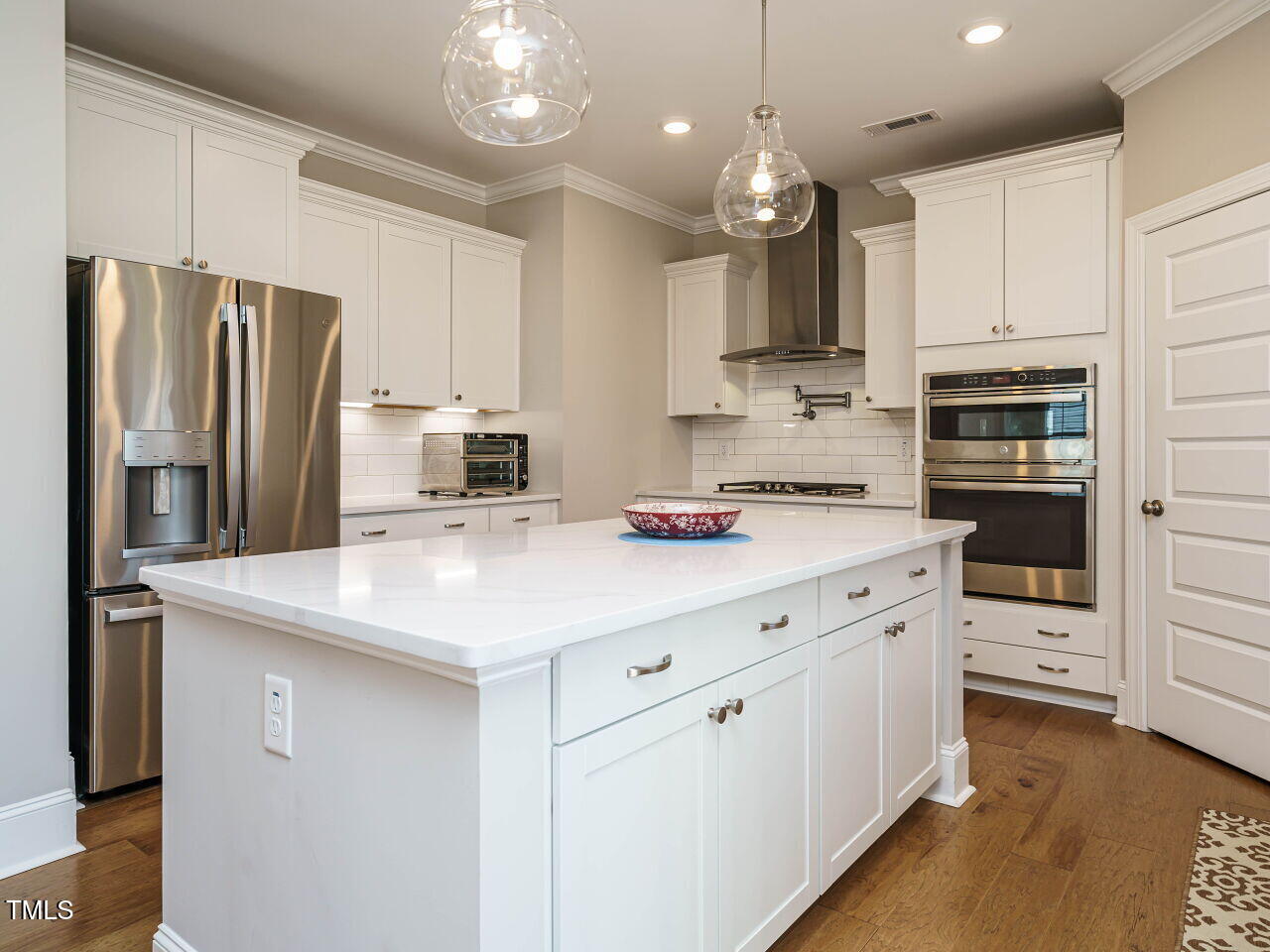 507 Dungannon Loop Clayton, NC 27520 - Photo 14 of 36 a kitchen with kitchen island granite countertop stainless steel appliances cabinets a sink and a counter top space