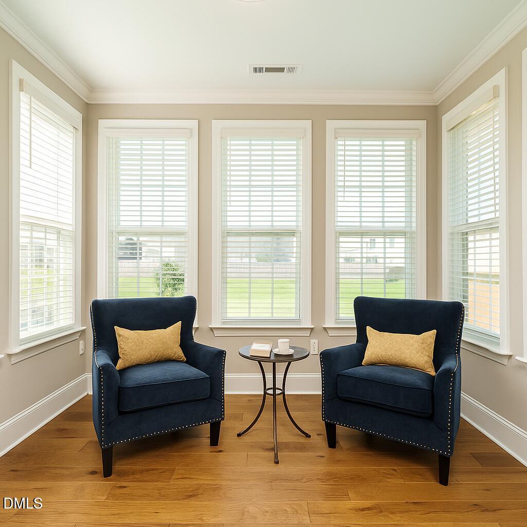 507 Dungannon Loop Clayton, NC 27520 - Photo 16 of 36 a living room with furniture and a large window