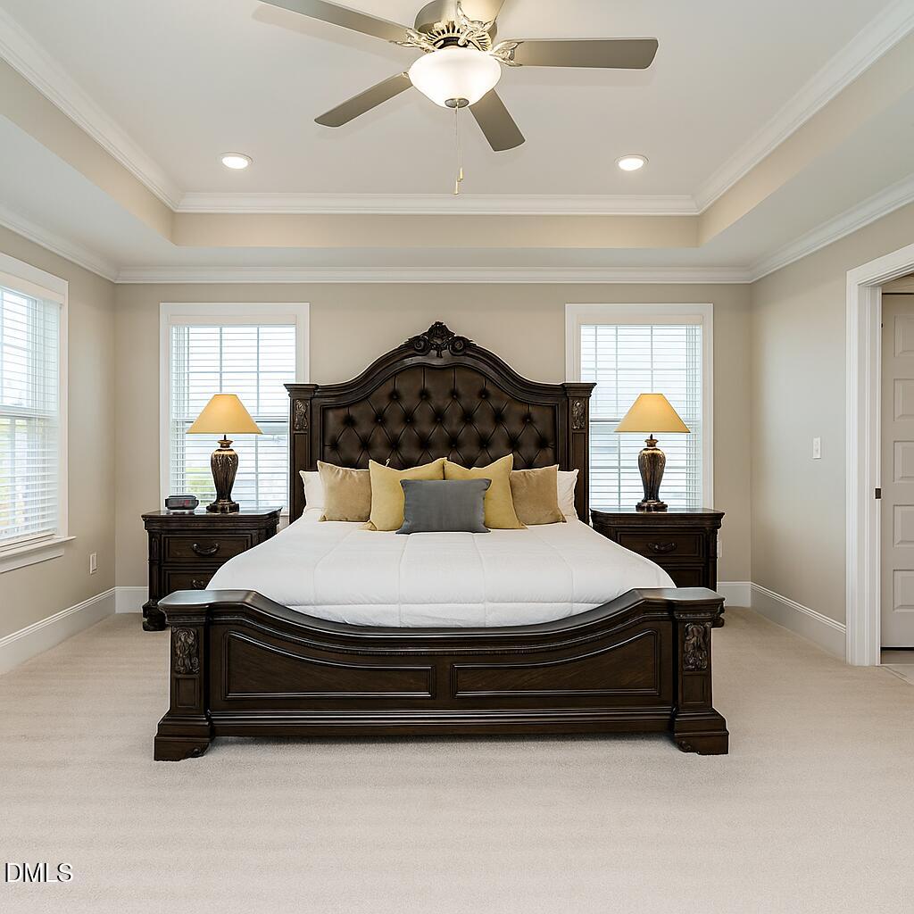 507 Dungannon Loop Clayton, NC 27520 - Photo 17 of 36 a bedroom with a bed and window