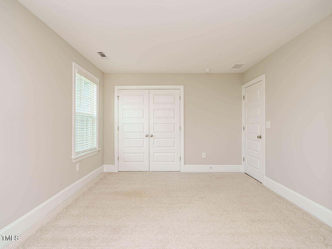 507 Dungannon Loop Clayton, NC 27520 - Photo 25 of 36 an empty room with windows