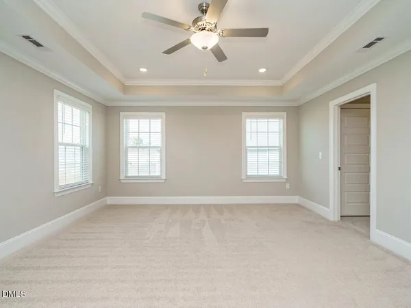 a bathroom with a granite countertop sink a toilet and a large mirror