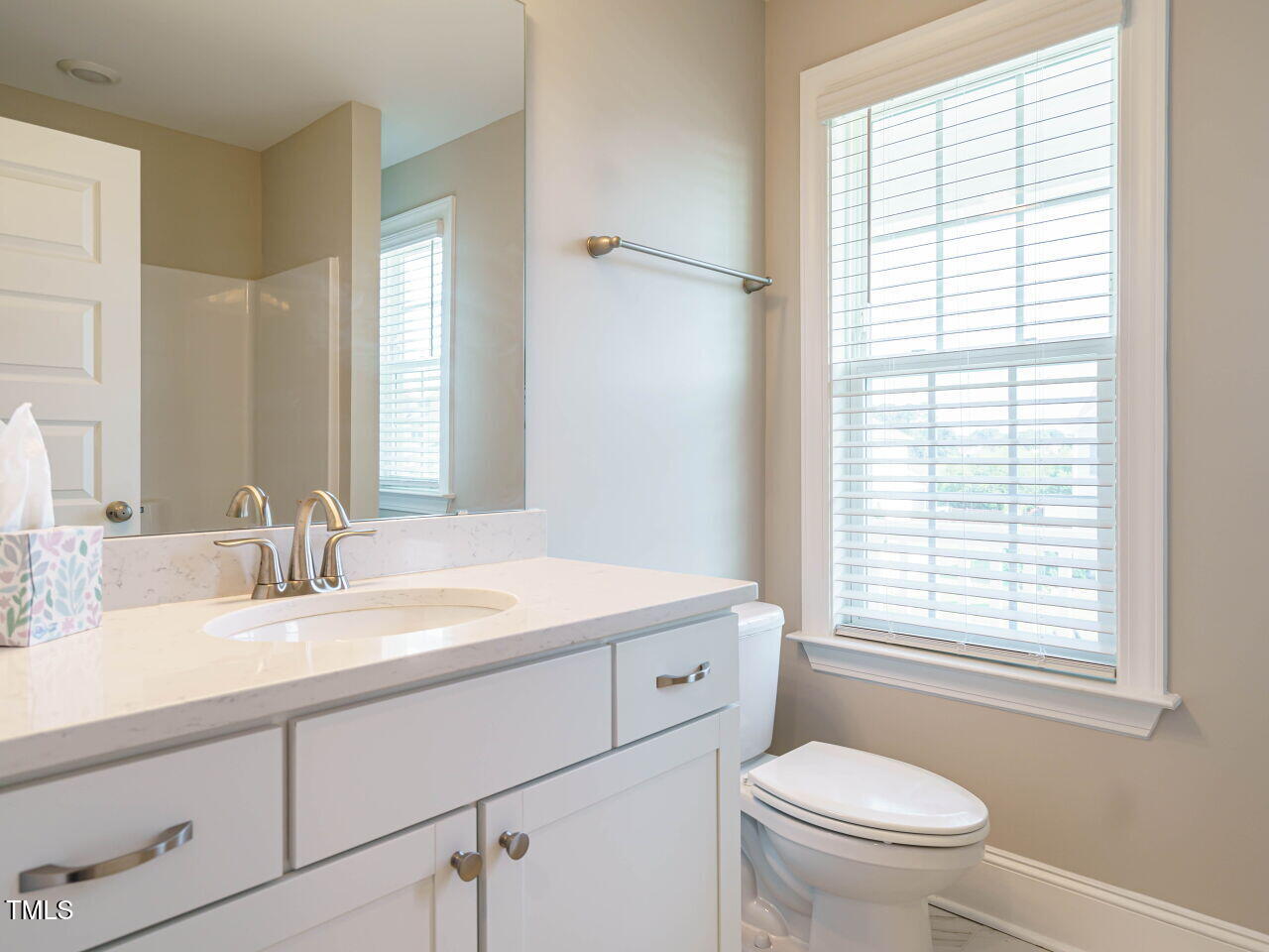 507 Dungannon Loop Clayton, NC 27520 - Photo 29 of 36 a bathroom with a sink a toilet and a window