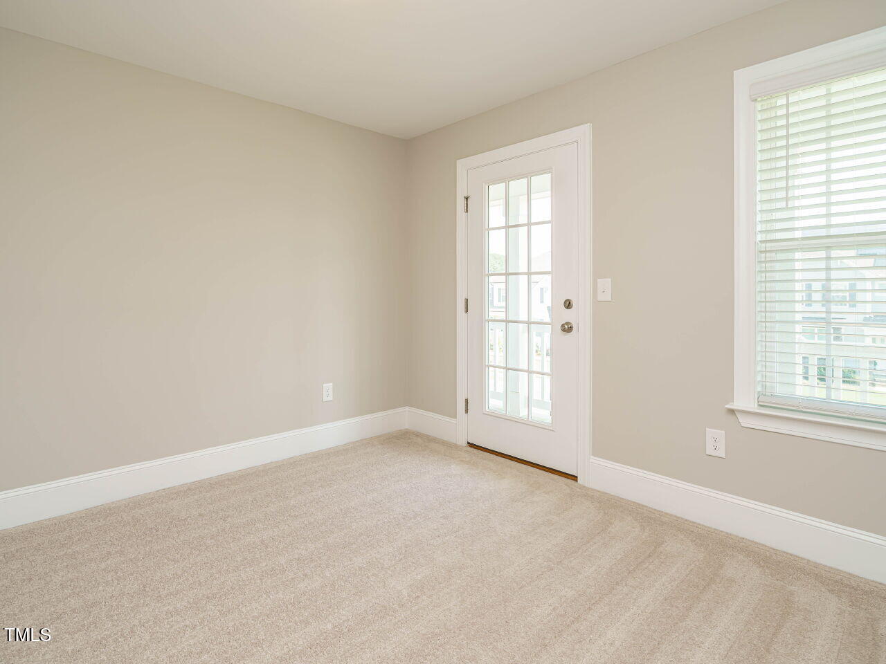 507 Dungannon Loop Clayton, NC 27520 - Photo 31 of 36 an empty room with windows
