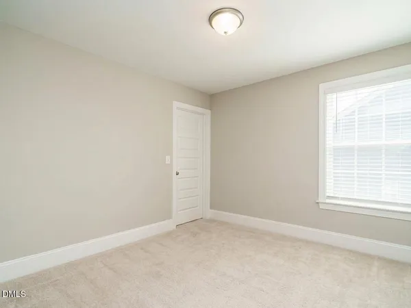 a view of a balcony with a table and chairs