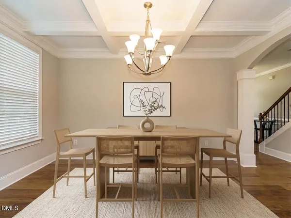 a kitchen with white cabinets and appliances