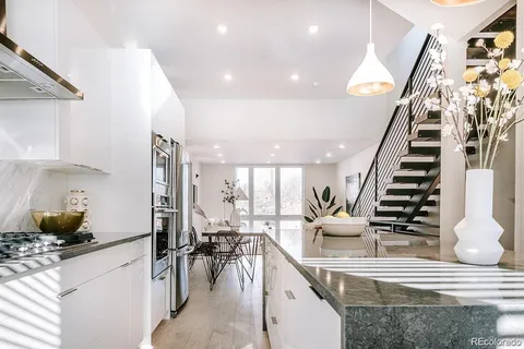 a view of a living room and entryway