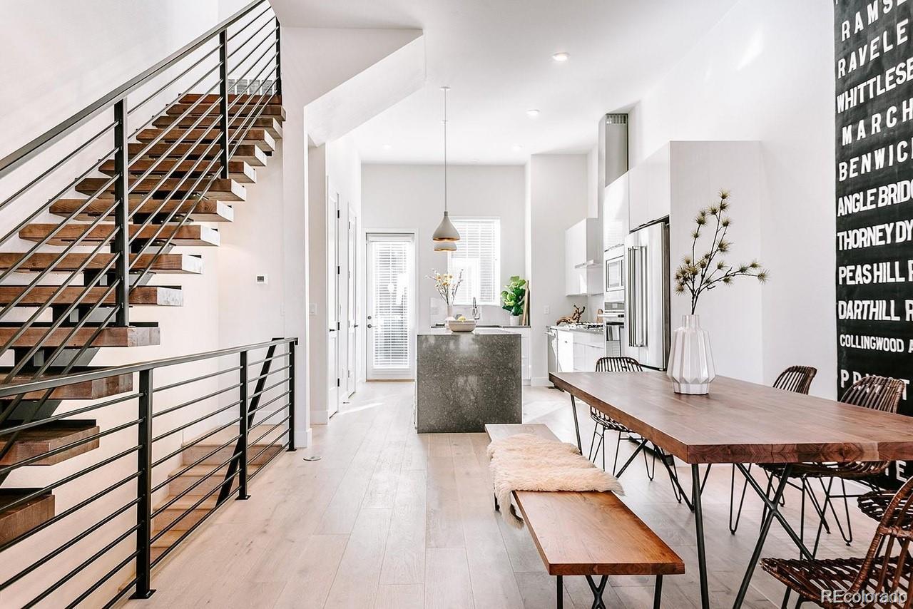 5125 West 29th Avenue, Unit 6 Denver, CO 80212 - Photo 2 of 26 a view of a dining room with furniture window and wooden floor