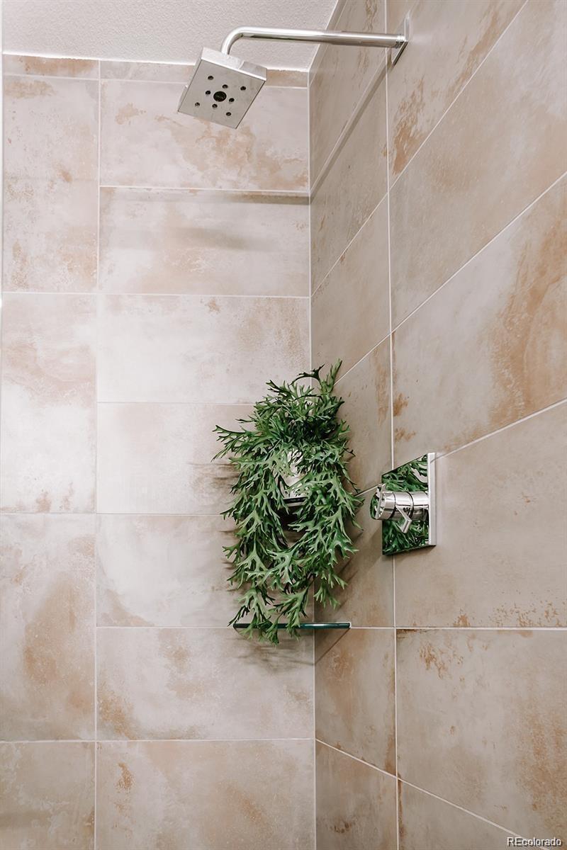 5125 West 29th Avenue, Unit 6 Denver, CO 80212 - Photo 21 of 26 a bathroom with a shower