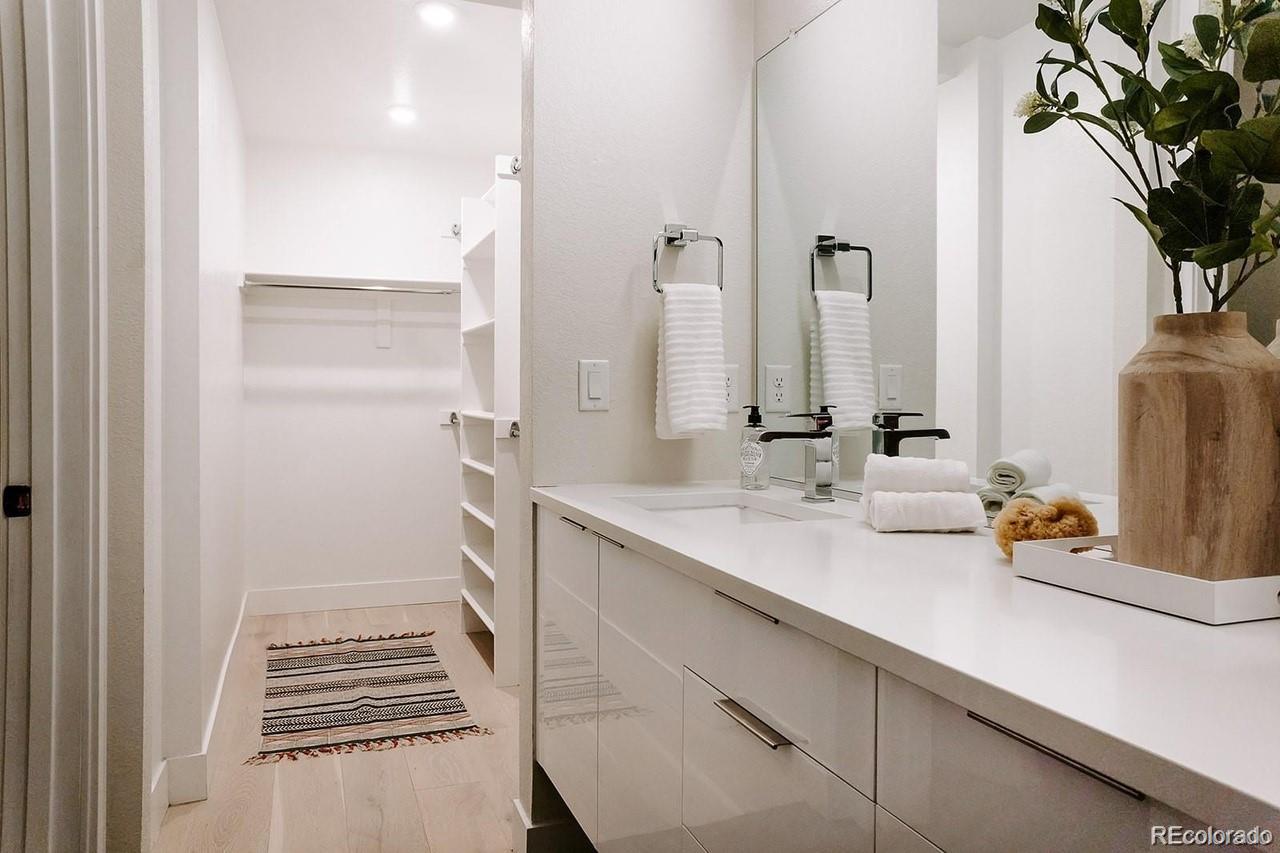 5125 West 29th Avenue, Unit 6 Denver, CO 80212 - Photo 22 of 26 a bathroom with a sink and a mirror