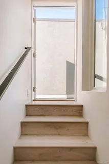 a view of a livingroom with furniture and a window