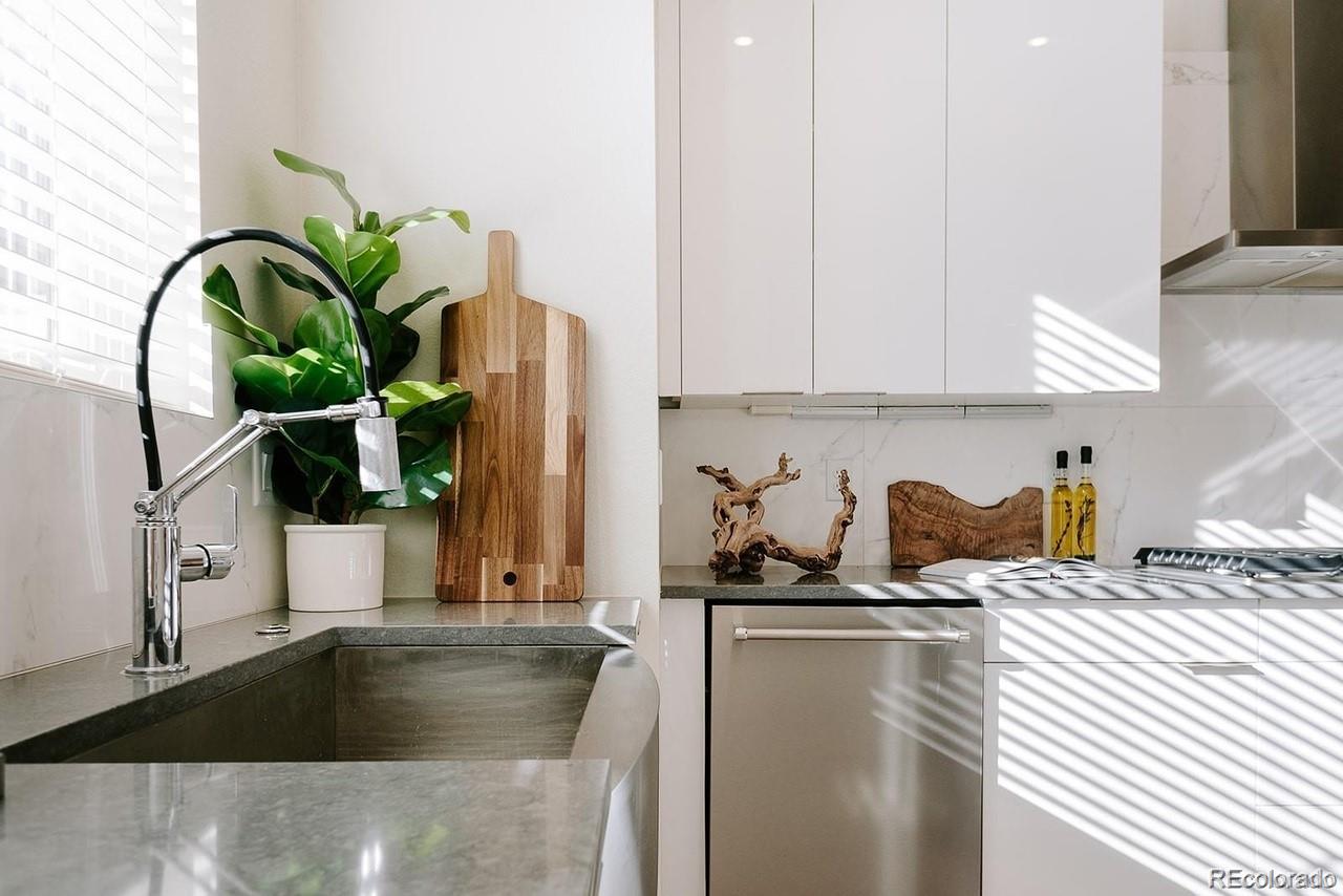 5125 West 29th Avenue, Unit 6 Denver, CO 80212 - Photo 6 of 26 a kitchen with a sink a counter and cabinets