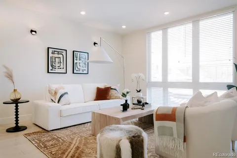 a living room with furniture and windows