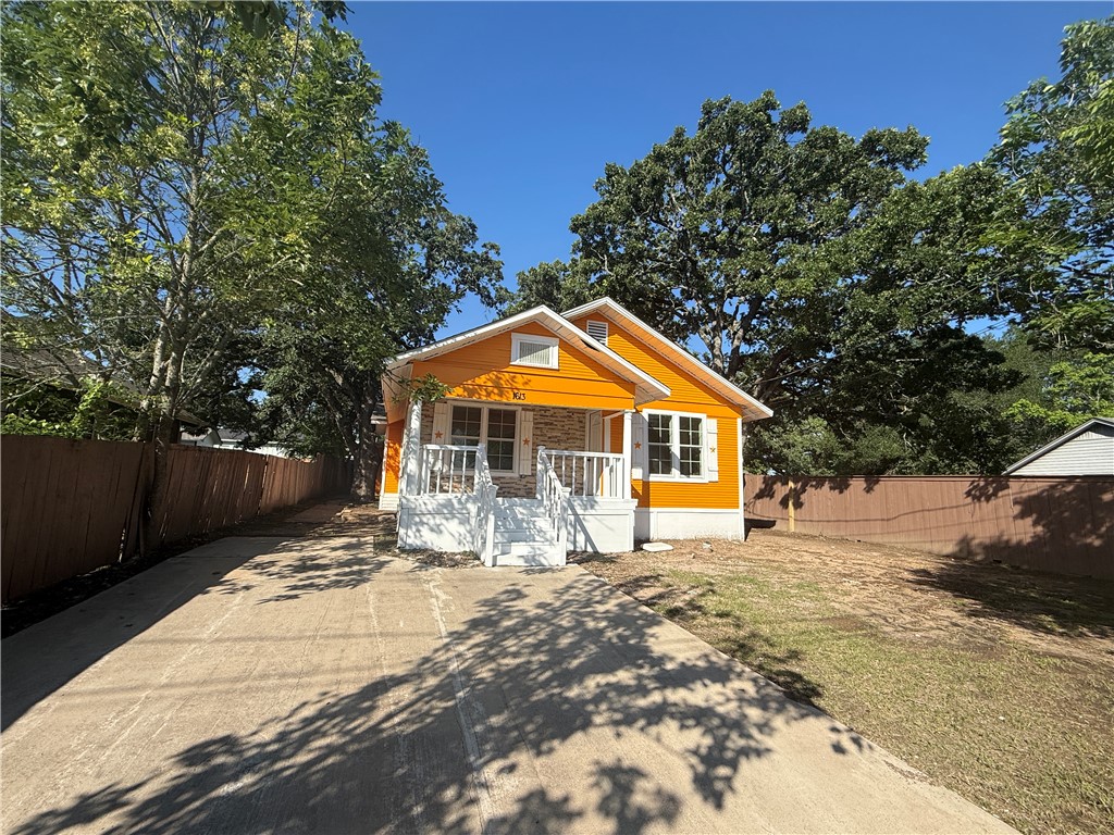 1613 Robeson Street Bryan, TX 77803 - Photo 1 of 18 a front view of a house with a yard